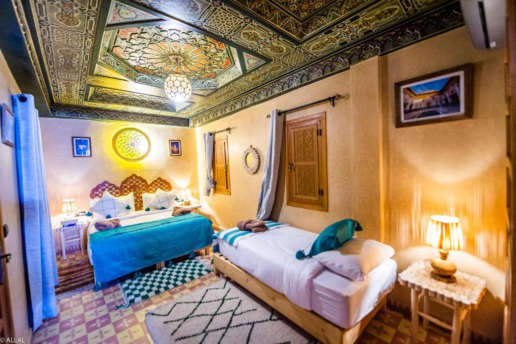 Triple room with turquoise bedding at Riad Almonds Marrakech
